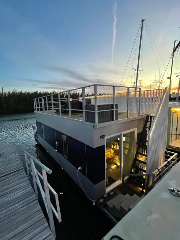 Casa Azul houseboat exterior and rooftop at dusk at The Perry Marina