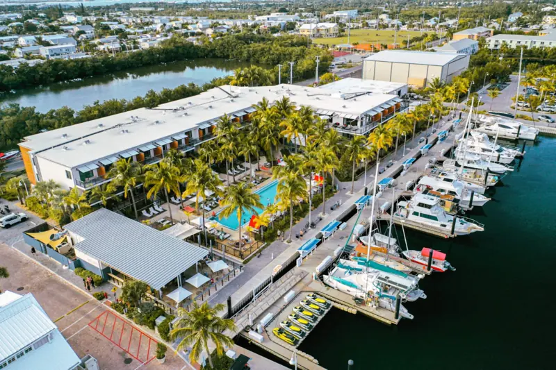 Aerial view of The Perry Hotel and Marina pools and docks on Stock Island, Key West